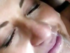 Lots of hot cum lands on her face