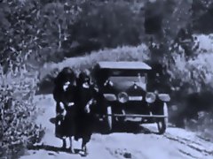 Two women walk down a road when a guy in a car comes along and offers...