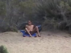 Dirty wife at the beach looking at naked men. Husband films.