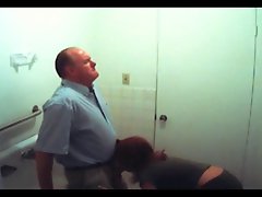 artificial spy redhead gives experienced man head in bathroom